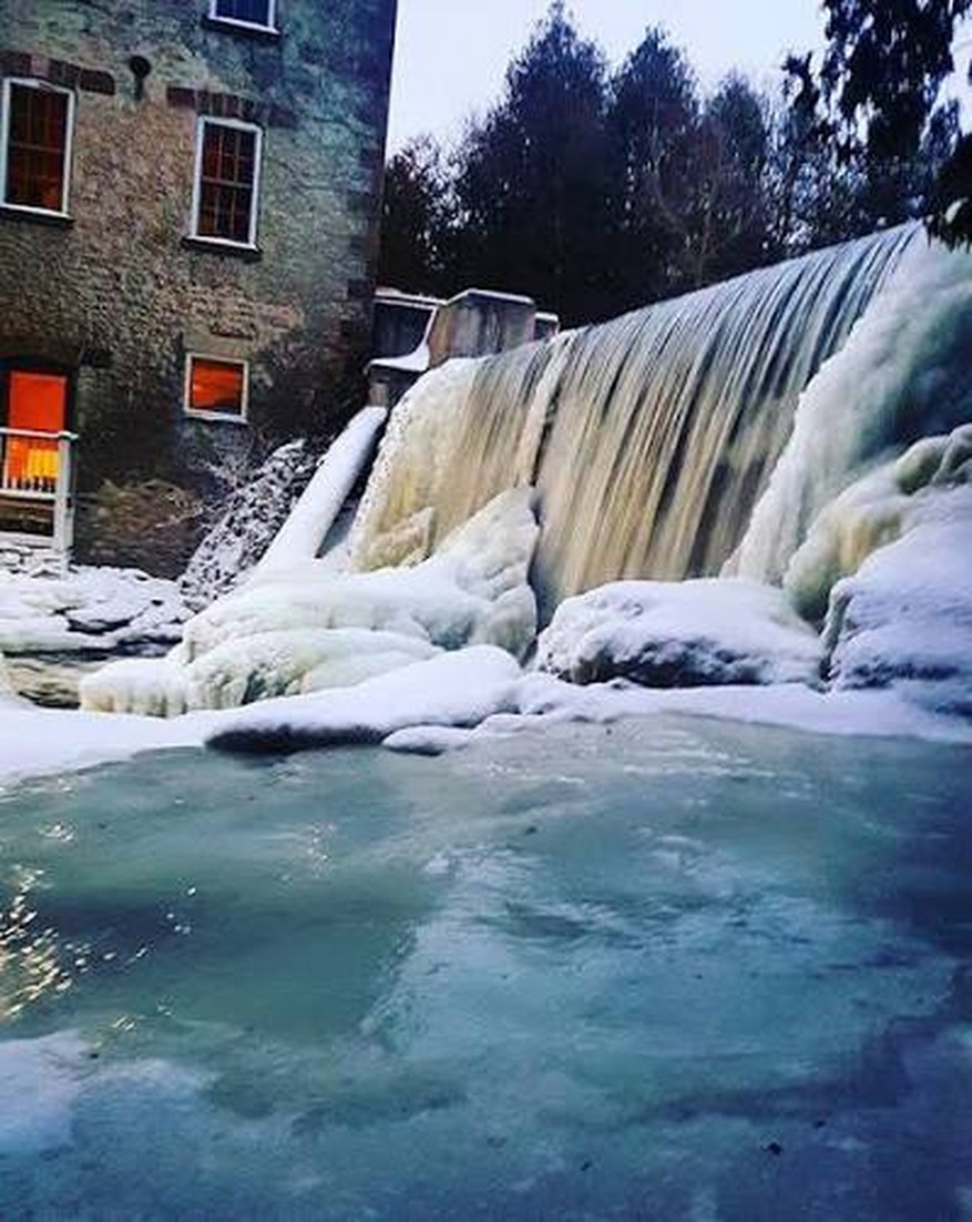 Frozen waterfall beside Millcroft Inn